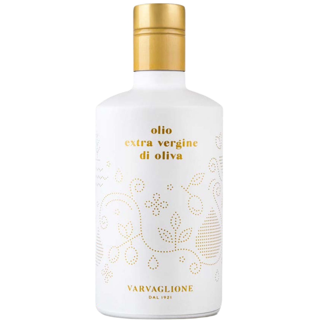 White bottle with gold cap and decorative text on a white background