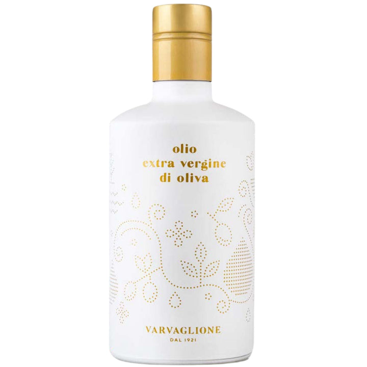 White bottle with gold cap and decorative text on a white background