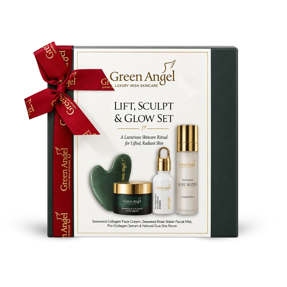Green Angel Lift, Sculpt &amp; Glow Set gift box with a red ribbon, containing skincare products including a cream jar, dropper bottle, and roller on a white background.