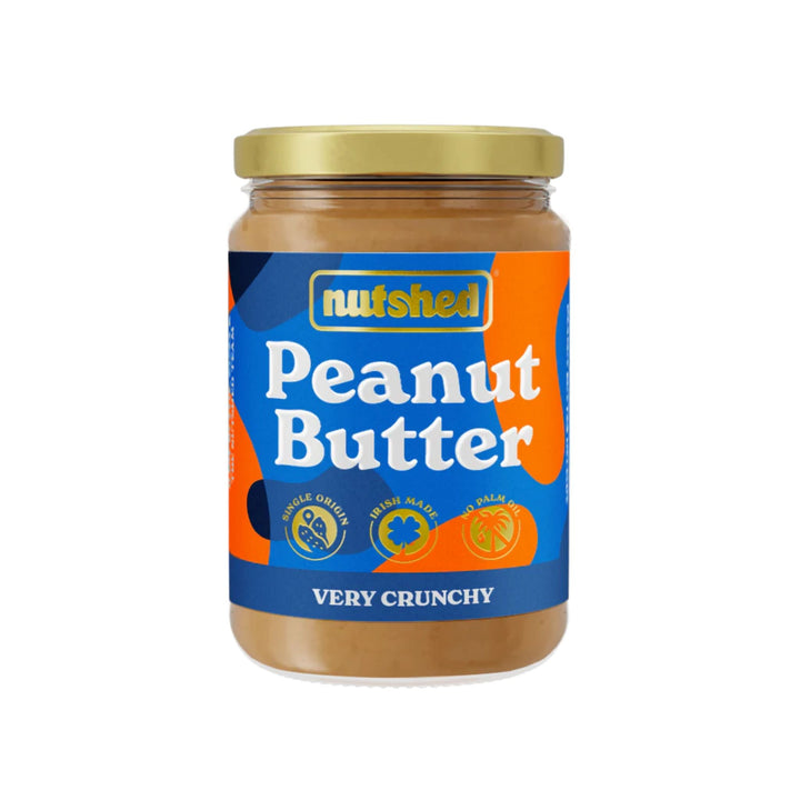 Jar of Nutshed peanut butter with blue label on a white background