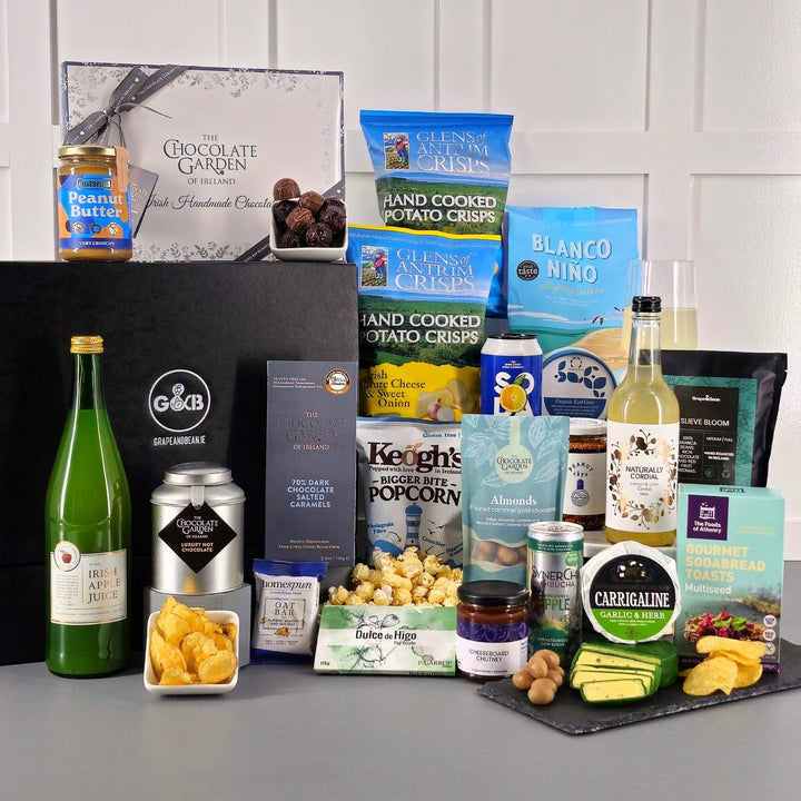 Deluxe Gluten Free hamper with crisps, chocolate, cheese, apple juice, tea, popcorn, chutney, cordial, peanut butter, fig paste, coffee, hot chocolate.