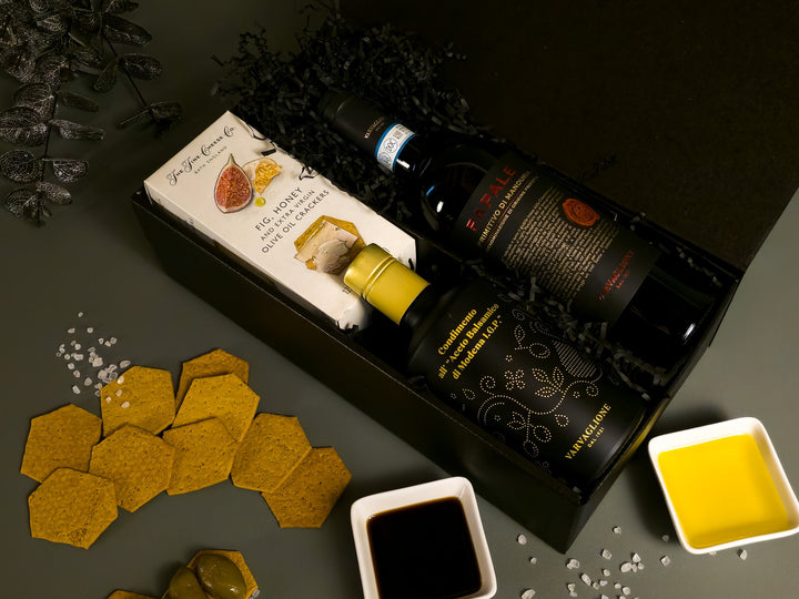 Gourmet gift set with olive oil, cheese, crackers and fine red wine