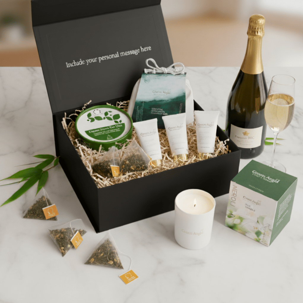 Gift box with skincare products, champagne, and tea on a marble surface