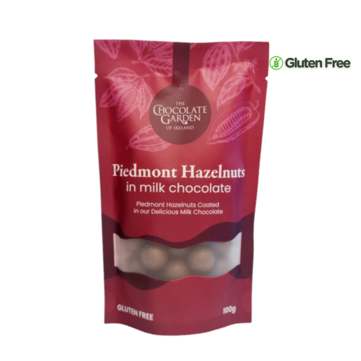 Red packaging of Piedmont Hazelnuts in milk chocolate from The Chocolate Garden of Ireland on a white background.