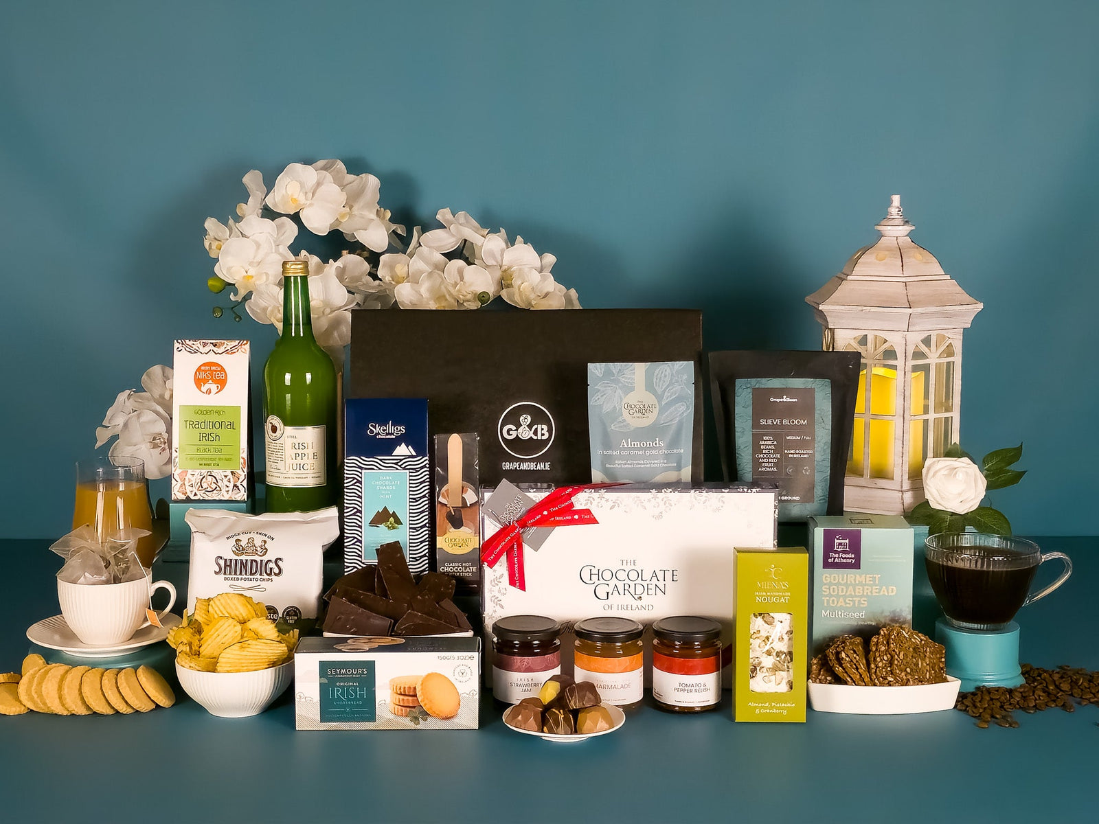 Large hamper with assorted chocolates, jam, relish, crisps, tea, coffee, apple juice, shortbread, nougat