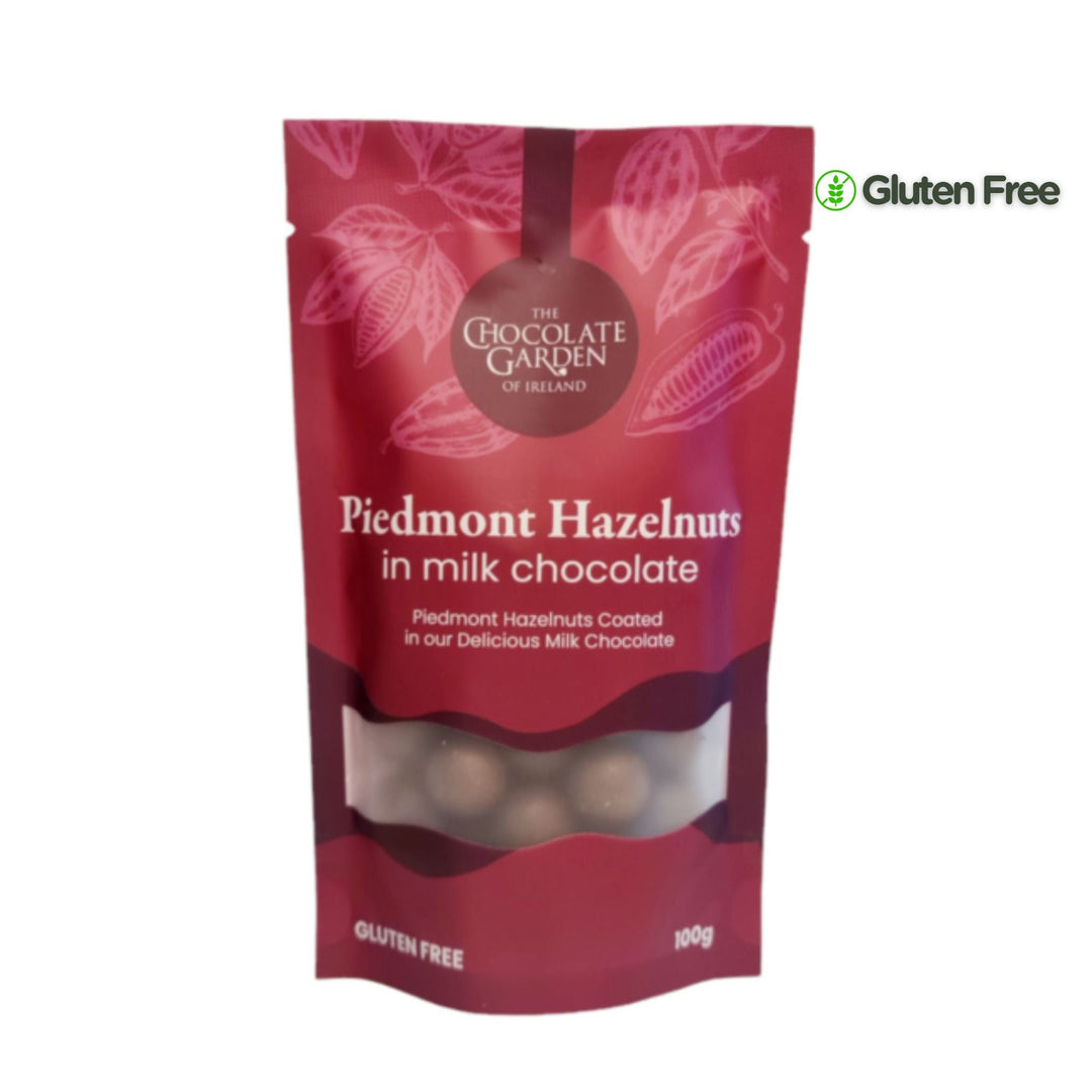 Red packaging of Piedmont Hazelnuts in milk chocolate from The Chocolate Garden of Ireland on a white background.